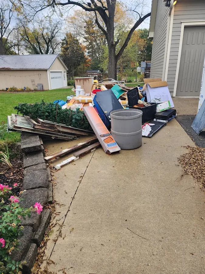 Dumpster being loaded with debris for 10 Yard Dumpster Rental in Coldwater